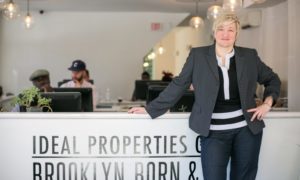 lady leaning on the table - How Custom Virtual Tours Can Save Your Real Estate Business in 2020