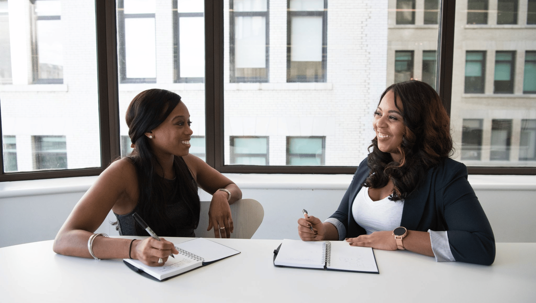 two women having fun discussion