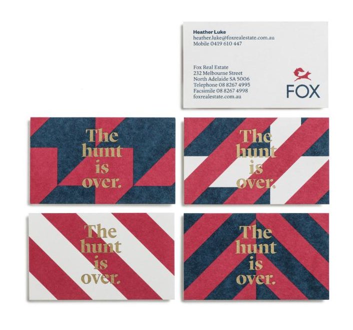 Bold red, white, and blue business card with art deco patterns