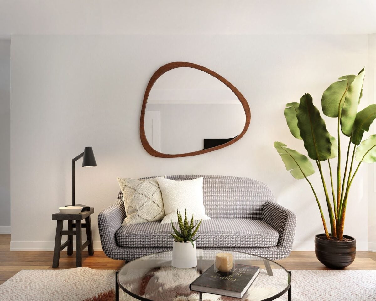 A living room filled with furniture and a mirror