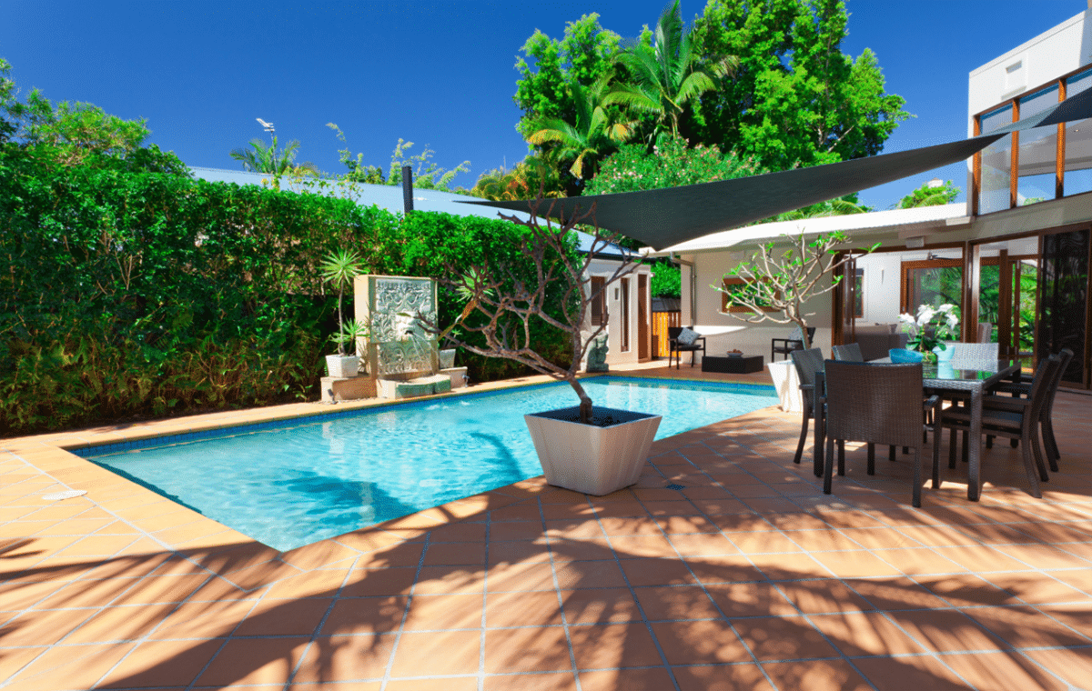 Image of a stunning back patio with a pool.