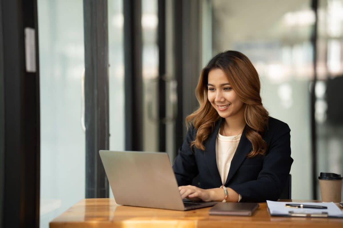 Women in front of a computer. 