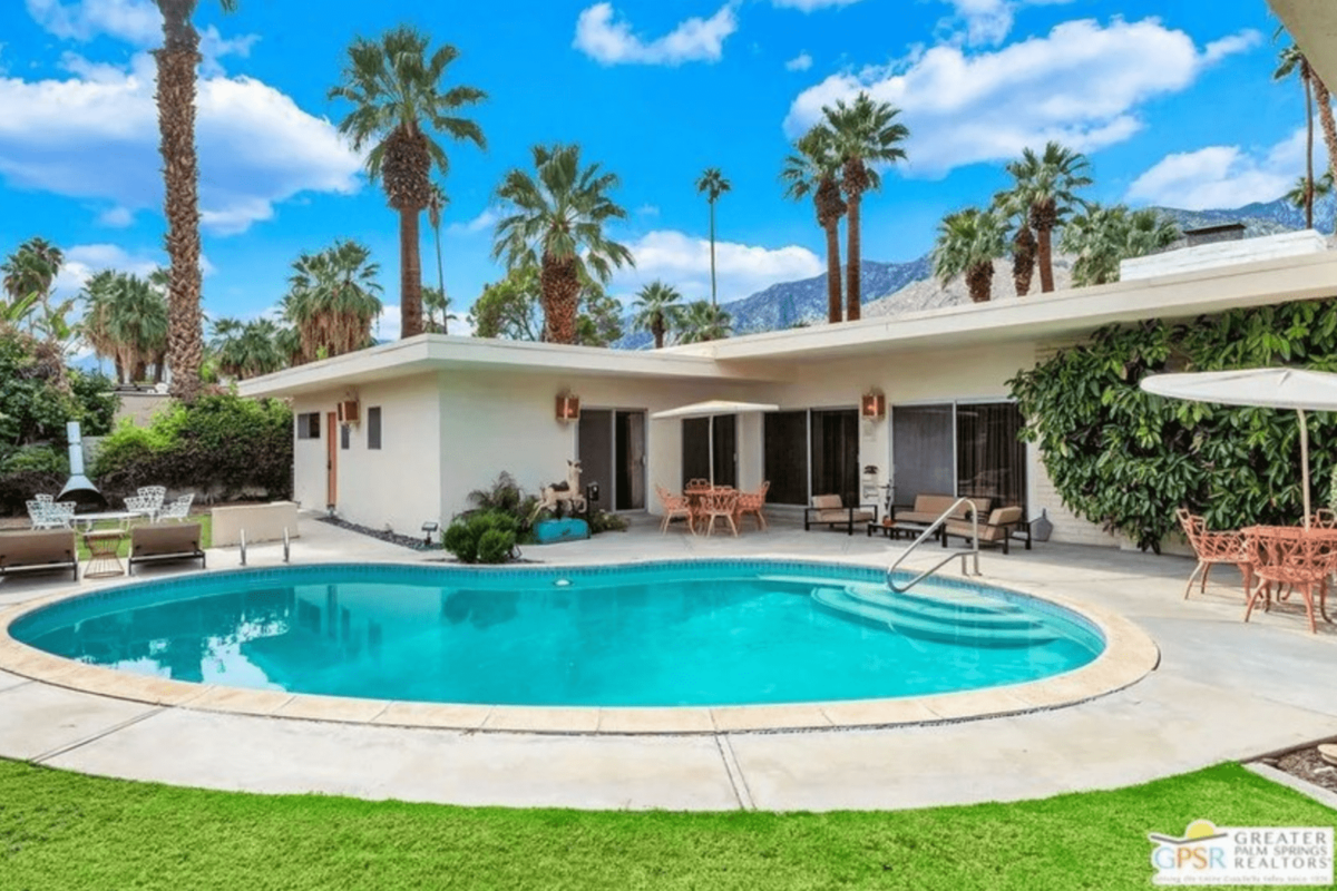 A white modern house with pool