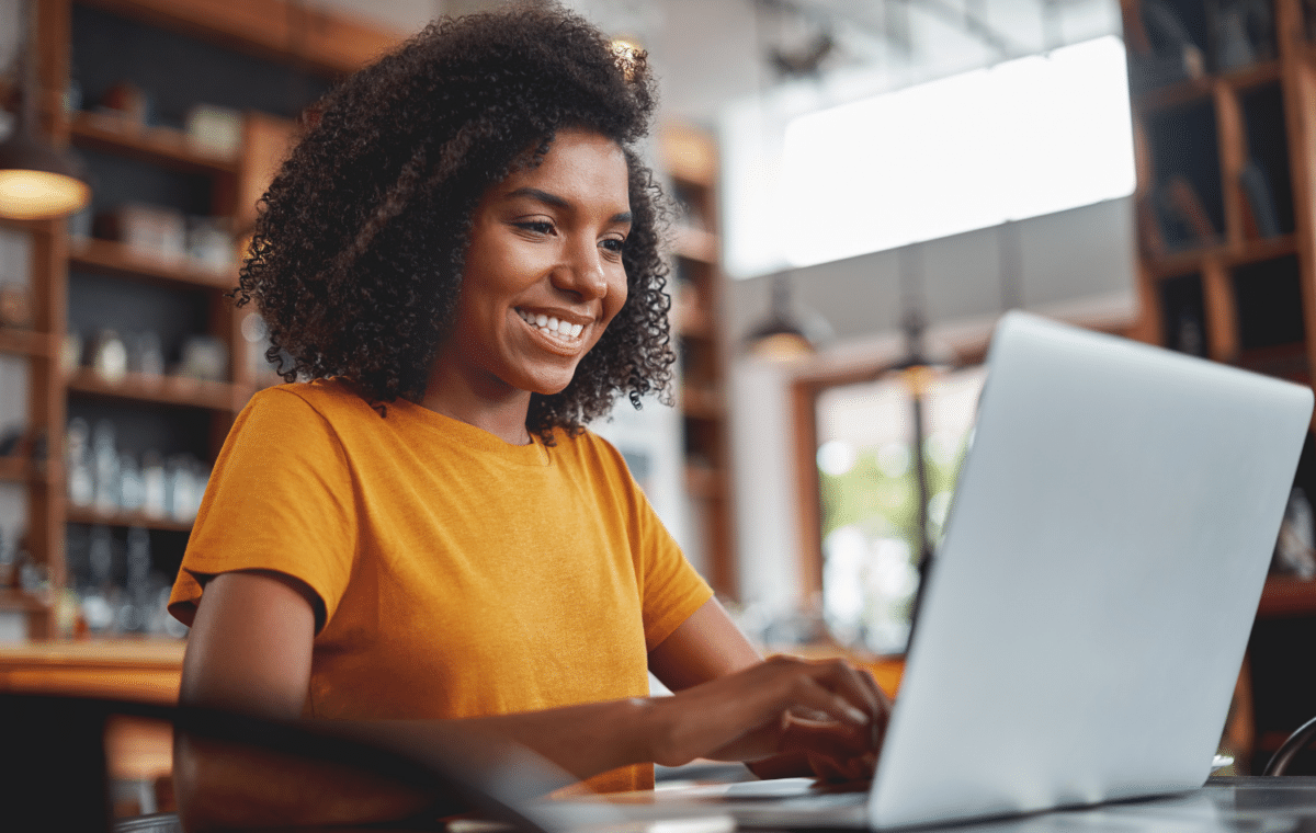 Woman smiling on her laptop