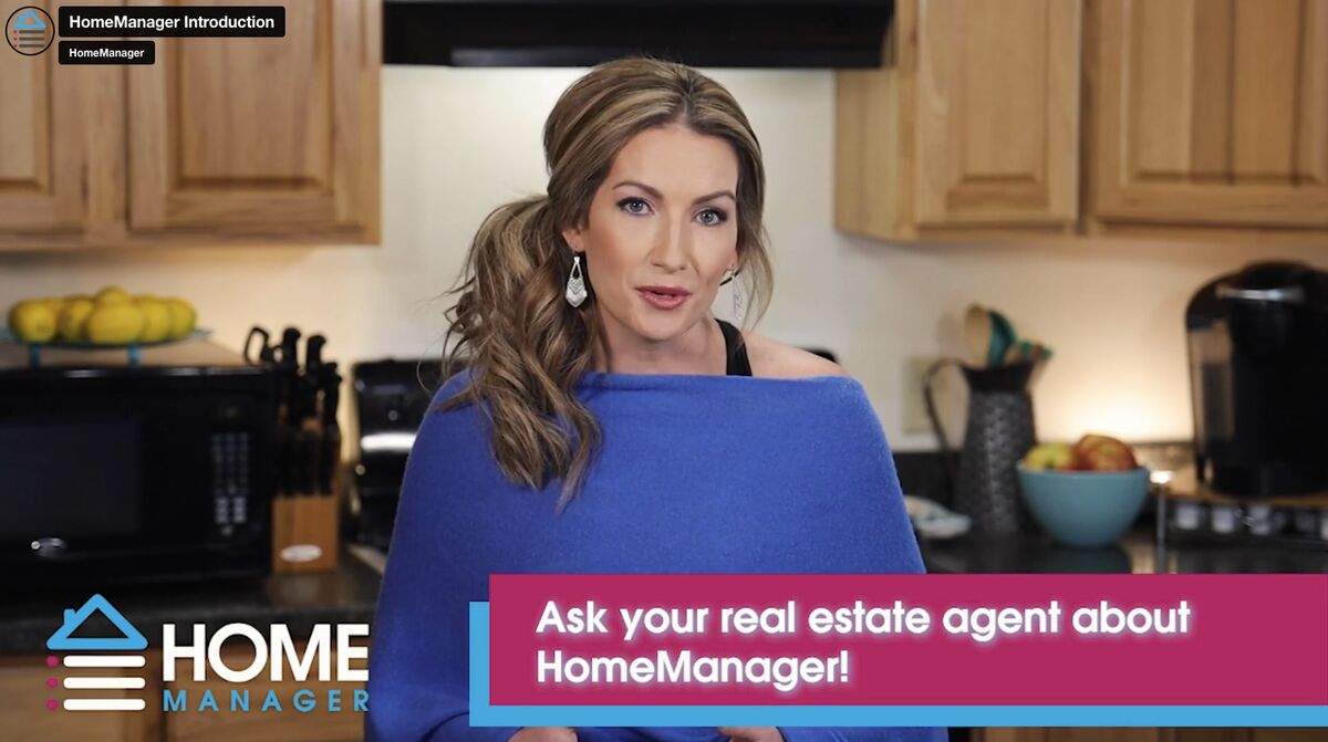 Screenshot of Home Manager introduction video with woman standing in kitchen talking to the camera. Overlay reads "Ask your real estate agent about HomeManager!"