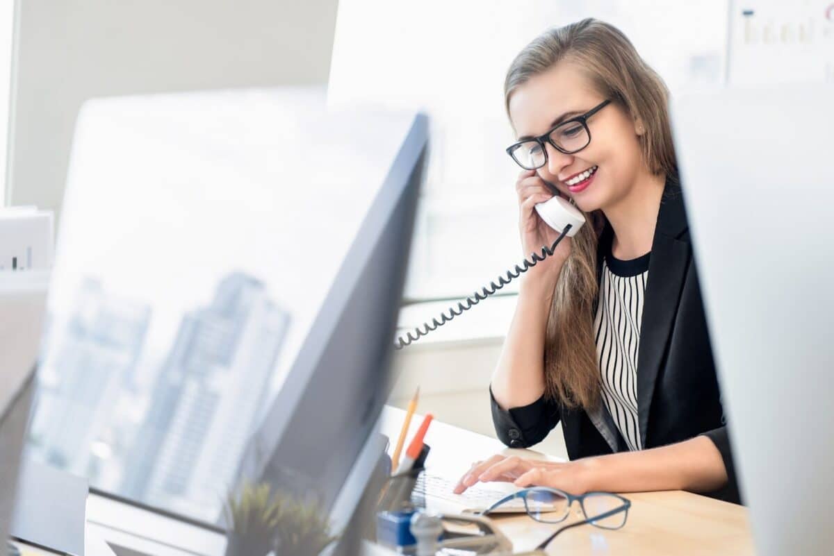 Woman talking on the phone with a client