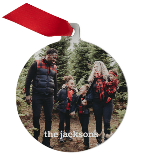 Ornament with image of a family standing in front of Christmas tree