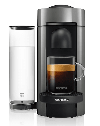 Coffee in coffee maker with full cup under spout