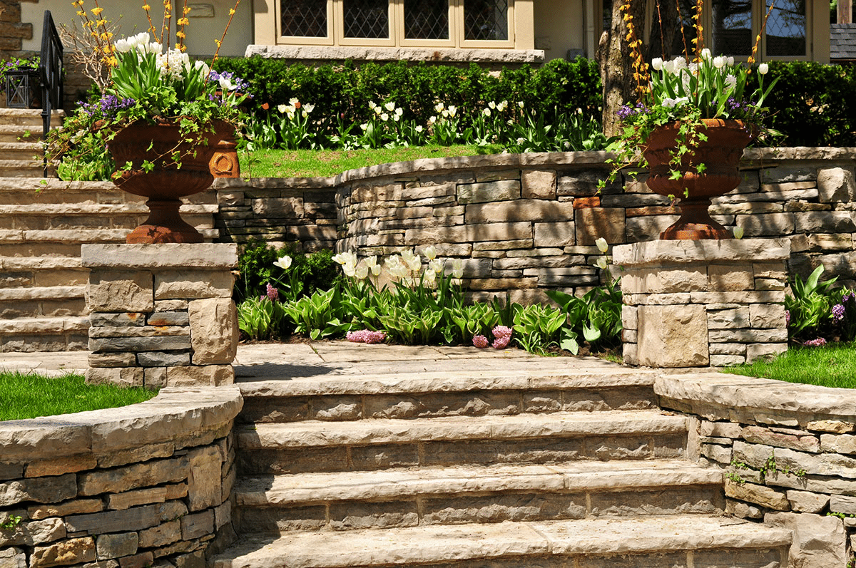 A garden with natural stone retaining walls