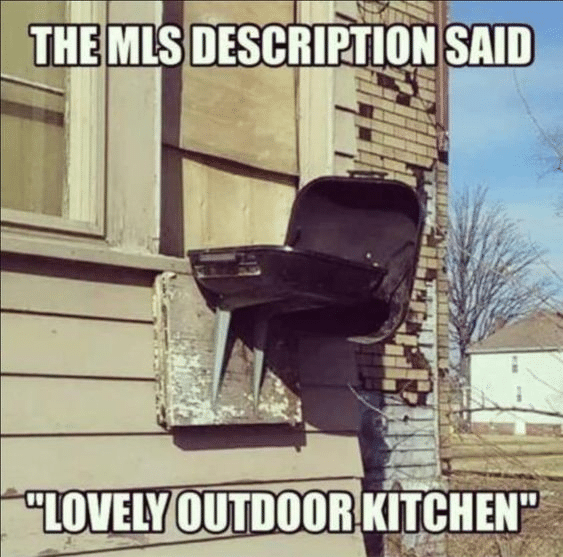 A grill attached to the exterior of a house.