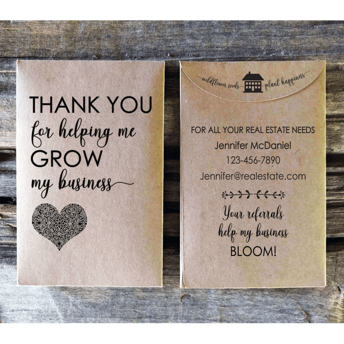 Two custom brown paper seed packets with a thank you note and real estate agent contact information on them.