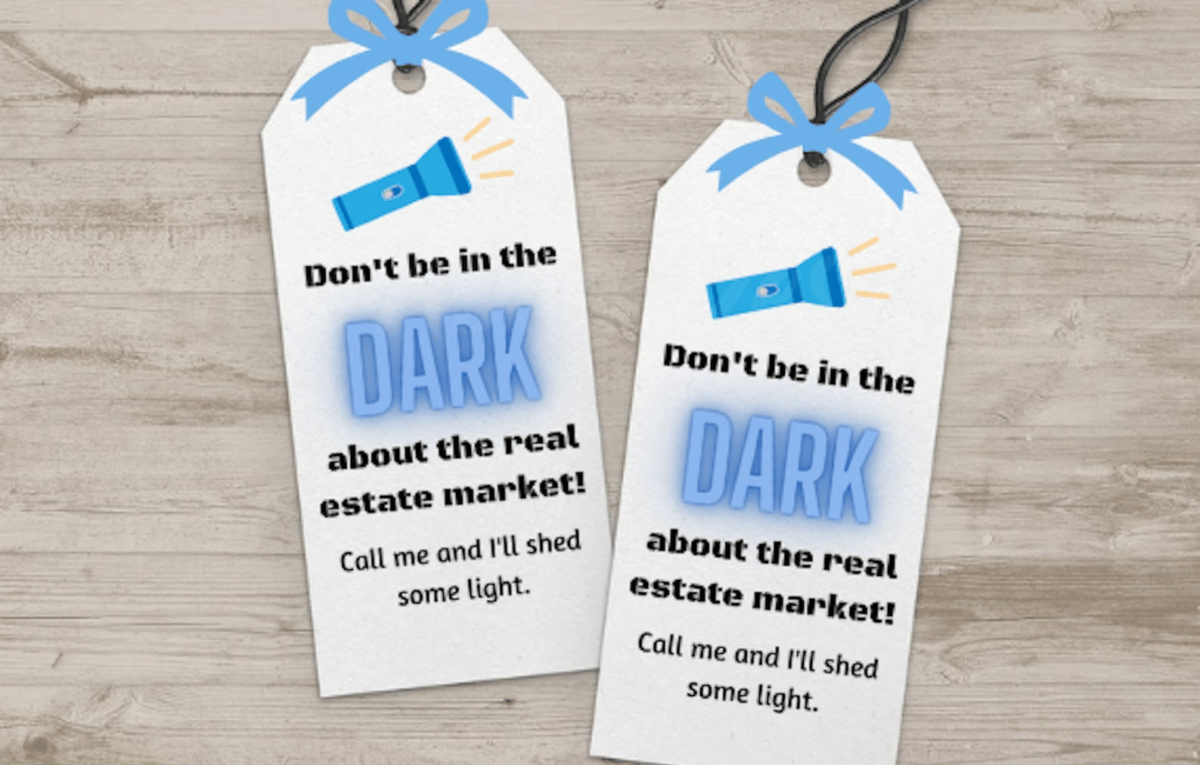 Two samples of real estate pop by tags with a picture of a flashlight on them and a message about the real estate market.