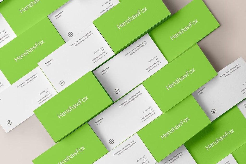 Green business card with white typography