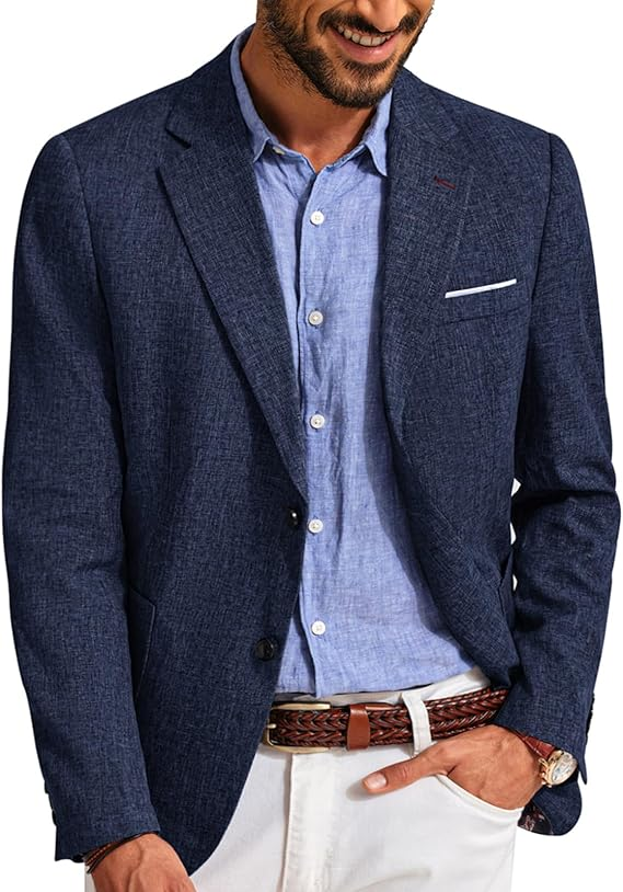 man in navy tweed blazer with a light blue dress shirt, khaki pants and a brown belt.