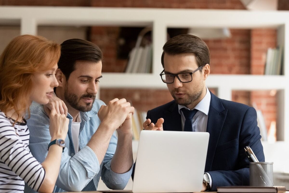 Real estate broker advising a couple