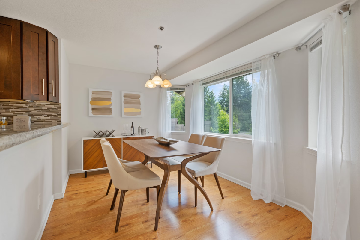 A dining room with renovated wooden floors