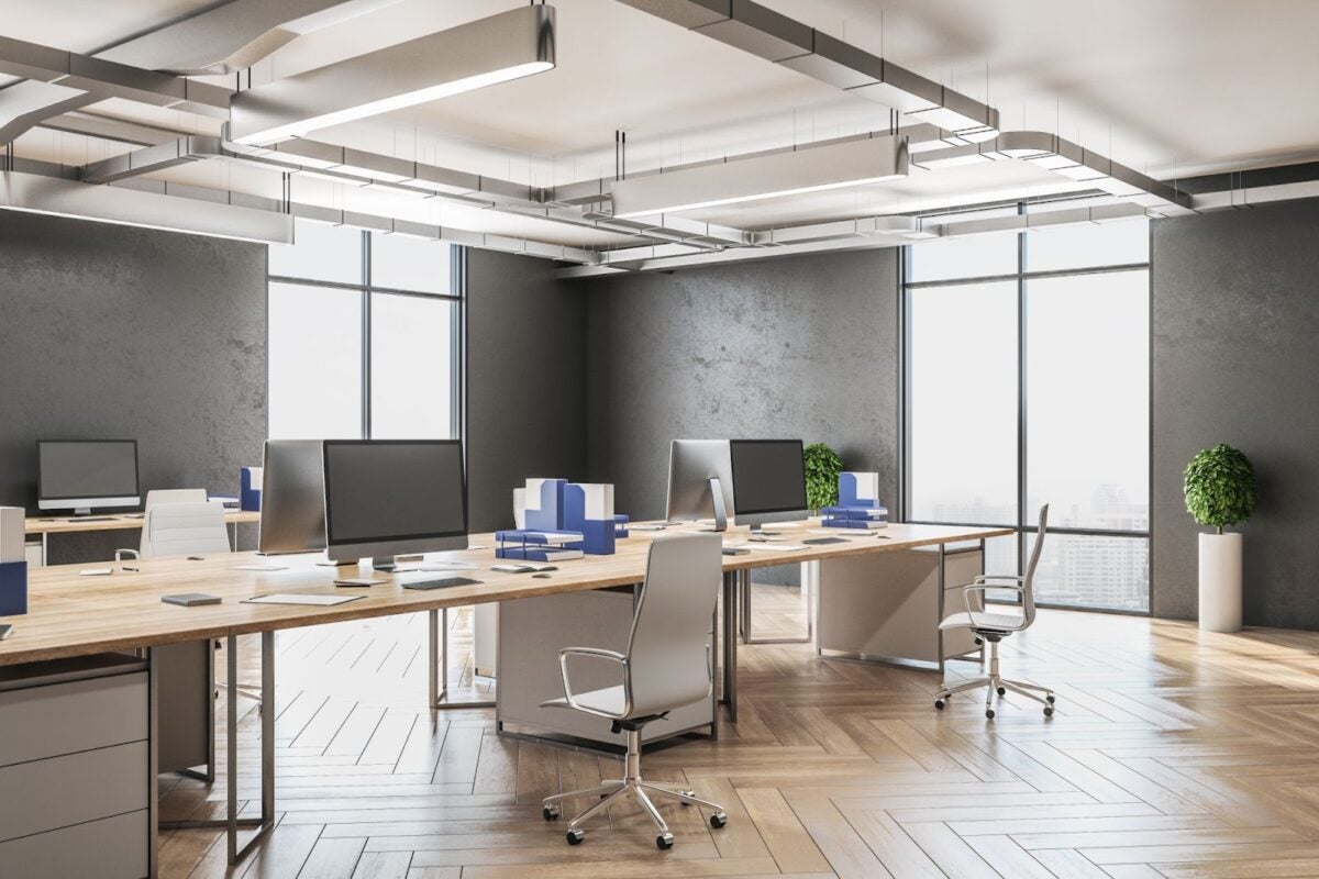 business office space with desk, computers and chairs