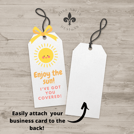 Tag with sun illustration says "Enjoy the sun! I've got you covered!" with space to attach a business card.