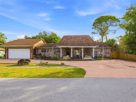 Exterior of home with stone facade.