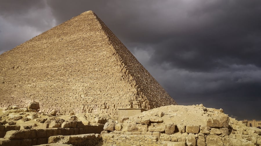 Great pyramid at Giza during a stormy day. clouds make a striking contrast over the pyramid.