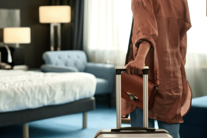 Close up of a girl entering a hotel room.