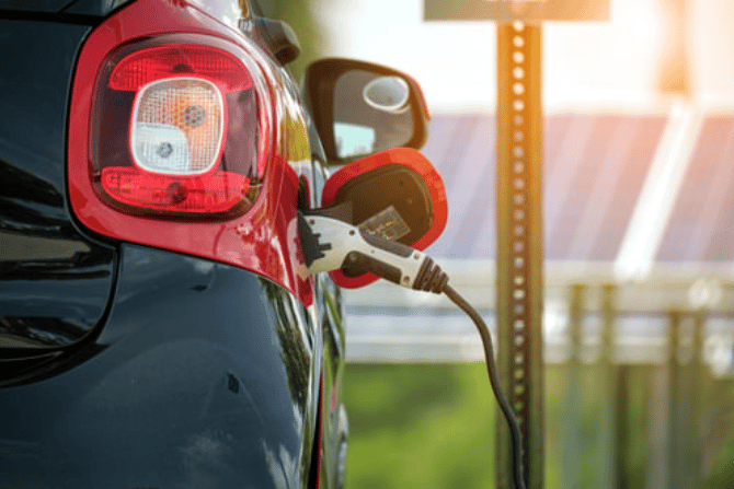 Electric car being plugged in.
