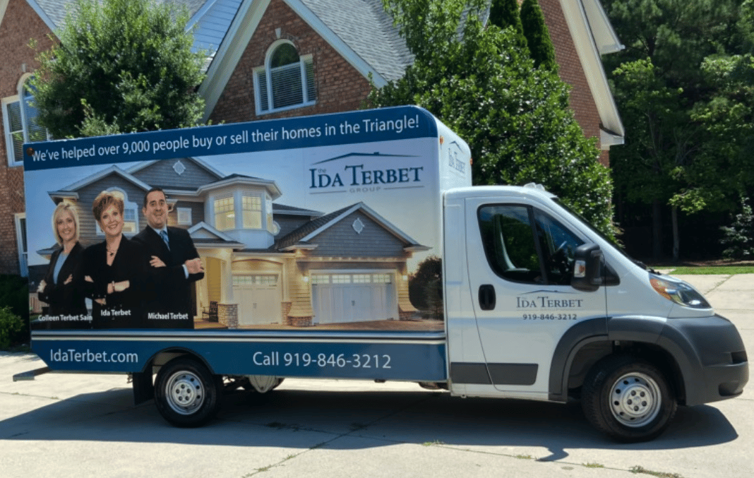 Branded real estate moving truck.